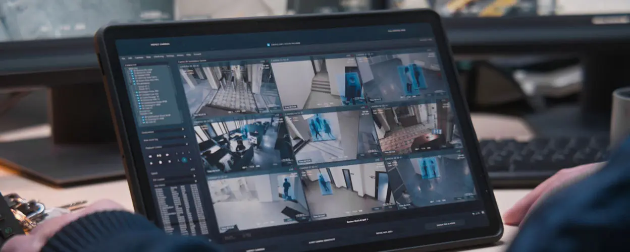 Multiple security camera views displayed on a portable screen.